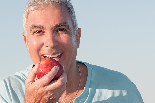 How Do Dentures Stay In Place?