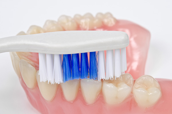 Preventing Bacteria Buildup on Dentures from GK Dental PC in Everett, MA